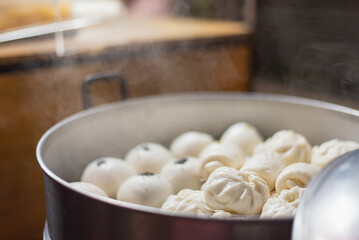 Steamed buns in a steaming hot potม Chinesse Food with Stream Pork Dumpling.