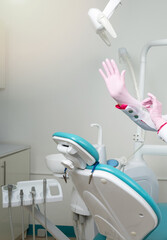 Dentist put on clean gloves