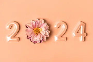 Poster Numbers and dahlia flowers. 2024 new year idea concept. Trendy color of year 2024 - Peach Fuzz. Trendy color palette sample. © Katya Slavashevich