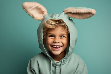Cheerful laughing child boy in a funny costume with bunny ears, Easter holiday concept - obrazy, fototapety, plakaty
