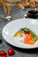 Summer healthy fastfood lunch, breakfast with Pancake with red fish, avocado and egg for breakfast. Aesthetic still life, healthy food concept