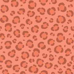 Vector seamless pattern in color of the year 2024 peach fuzz with animal leopard skin