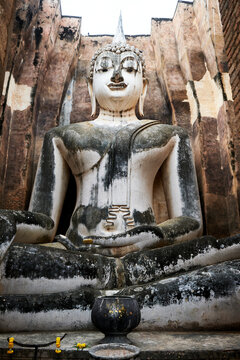 Old statue of buddha in sukhothai, thailand