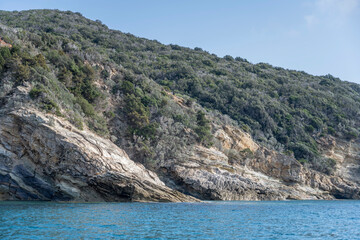 Fototapeta na wymiar rocky coast near Purgatorio cove, Argentario, Italy