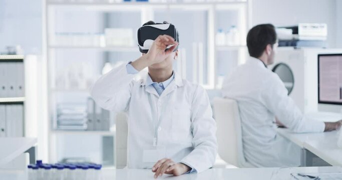 Woman, scientist and VR or futuristic glasses for healthcare software, metaverse and 3d laboratory in digital experience. Medical worker or doctor hands in virtual reality, science research or vision