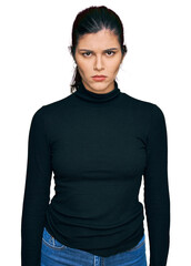 Young hispanic woman wearing casual clothes skeptic and nervous, frowning upset because of problem....
