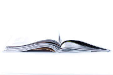 Open magazine isolated on white background