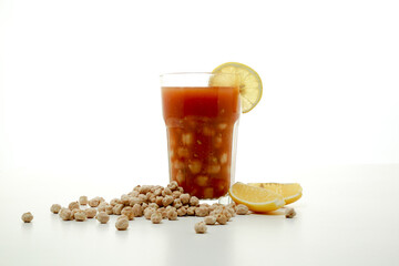 Halabsa chickpea soup with lime slice served in glass isolated on grey background side view of healthy morning arabic drink