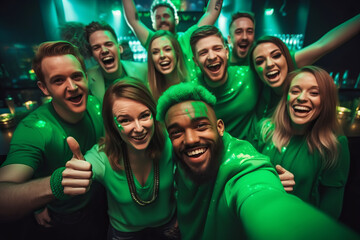 Multiracial friends having fun, wearing green costumes and celebrating St. Patrick's Day in night club party