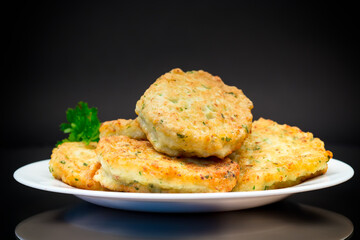 cooked fried potato cutlets with herbs
