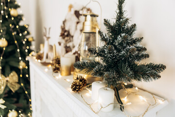 Cozy flat apartment photo studio room green Christmas Tree gifts presents garlands, candles decorated toys balls interior New Year lights glowing bokeh

