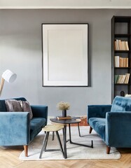 Blue sofa and chair against floor to ceiling window with forest view. Scandinavian home interior design of modern living room