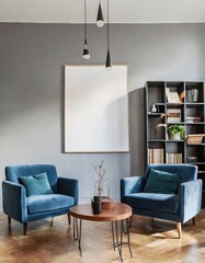 Blue sofa and chair against floor to ceiling window with forest view. Scandinavian home interior design of modern living room
