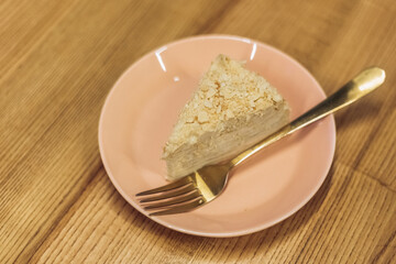 Piece of creamy chocolate cake with nuts on plate, tasting dessert. Chill, relax, lunch 

