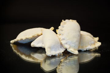 Raw dumplings with filling inside, Ukrainian cuisine.