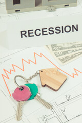 Keys of home, dollars, downward graphs and inscription recession on construction diagrams. Real...