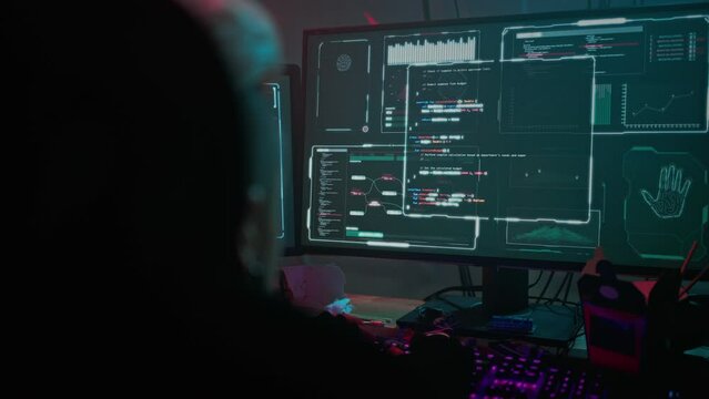 Hacker watches server decoding process on computer monitors