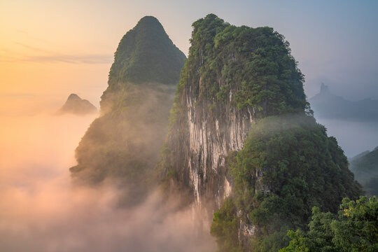 Aerial view of Guilin mountain landscape at sunrise with fog, Guangxi, China.