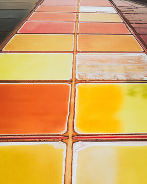 Aerial view of colourful Salinas, salt lakes pool at Farm colony la Algaida, Andalusia, Spain.