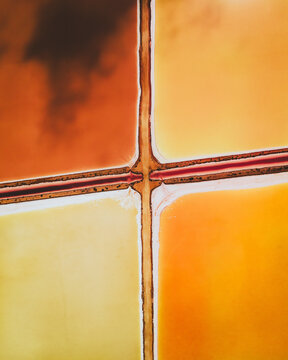 Aerial view of colourful Salinas, salt lakes pool at Farm colony la Algaida, Andalusia, Spain.