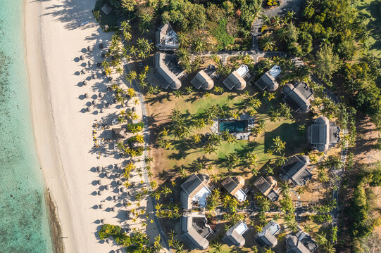 Aerial view of bungalows of luxury resort with swimming pool along the beach in Le Morne, Rivi&egrave;re Noire, Mauritius.