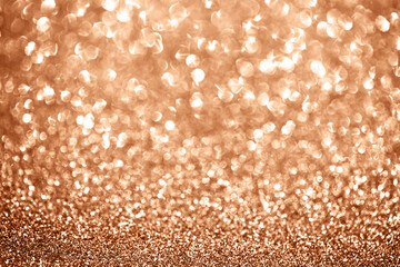 Sparkling glittering beige background. Demonstrating color of 2024 year - peach. - 689818837