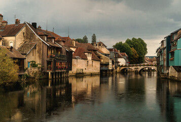 Fototapeta na wymiar Village houses along river, Ornans, Doubs, Bourgogne-Franche-Comte, France