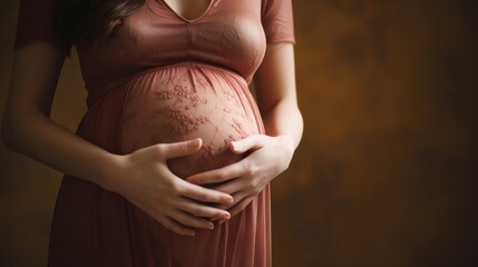 Image of pregnant woman touching her belly with hands
