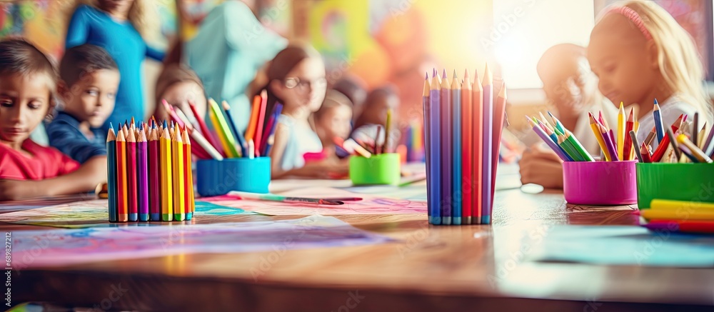 Aufkleber art and creativity in an elementary school class teacher shows his students how to draw using a colo