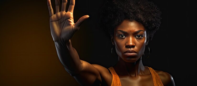 Confident black woman protesting against racial discrimination isolated on background Young diverse afro woman showing black lives matter gesture stop racism human rights concept. Copyspace image