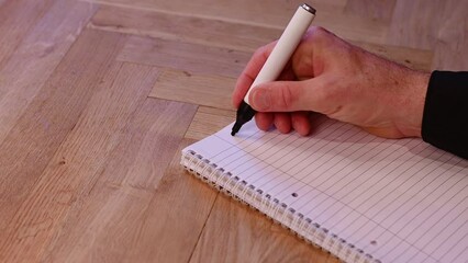 Blank notepad in class on wooden desk for student learning English written language. Language subject for adult learning with handwritten notes and writing exercises for personal development