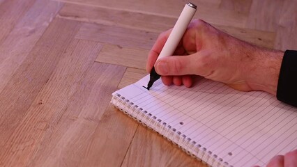 Blank notepad in class on wooden desk for student learning Spanish written language. español, subject for adult learning with handwritten notes and writing exercises for personal development
