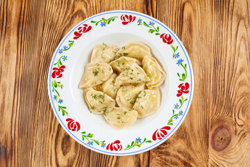 dumplings with meat on the wooden background