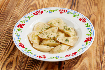 dumplings with meat on the wooden background