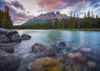 View of Lake Moraine at sunset, a beautiful lake with mountains and snow in Banff National Park, Alberta, Canada.