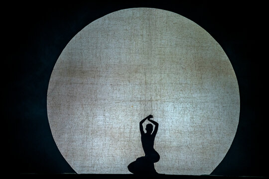 Yunnan, China - 26 October 2023: View of a woman performing a dance on the theatre stage, China.