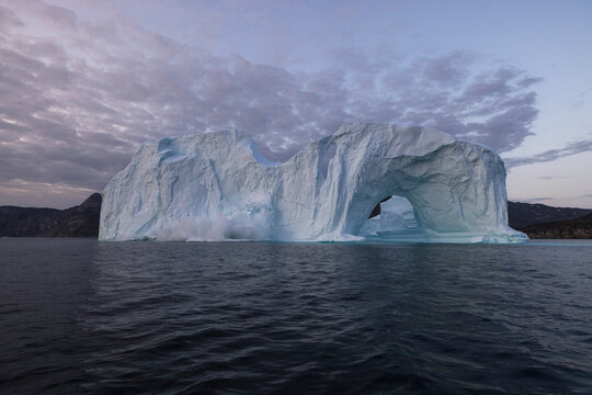 View of collapsing crushing iceberg at Ilulissat, Greenland.