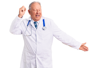 Senior handsome grey-haired man wearing doctor coat and stethoscope dancing happy and cheerful, smiling moving casual and confident listening to music