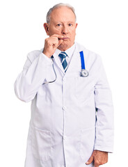 Senior handsome grey-haired man wearing doctor coat and stethoscope mouth and lips shut as zip with fingers. secret and silent, taboo talking