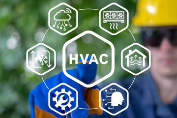 Engineer using virtual interface presses abbreviation: HVAC. Heating Ventilation Air Conditioning (...