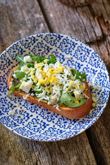 Toast with arugula and boiled egg