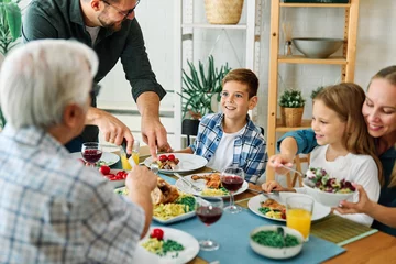 Foto op Aluminium child family lunch food woman meal eating mother dinner man father together happy daughter home table dining parent grandparent © Lumos sp