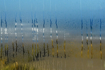 Impressionistic  beach scene through condensation on window