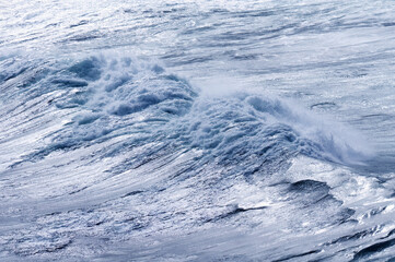 big giant waves breaking on a stormy day in atlantic sea ocean