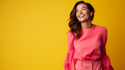 A joyful ultra beauty businesswoman, representing confidence, wearing a bright pink dress against a vibrant yellow background, smiling radiantly.