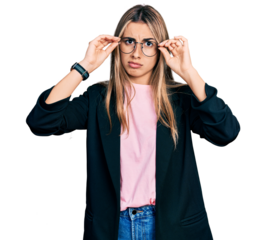 Hispanic young woman wearing elegant jacket and glasses skeptic and nervous, frowning upset because of problem. negative person.