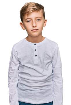 Little caucasian boy kid wearing casual clothes relaxed with serious expression on face. simple and natural looking at the camera.