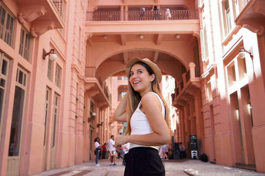 Portrait of young woman visiting the historic palace Casa de Cultura Mario Quintana in Porto Alegre, Brazil