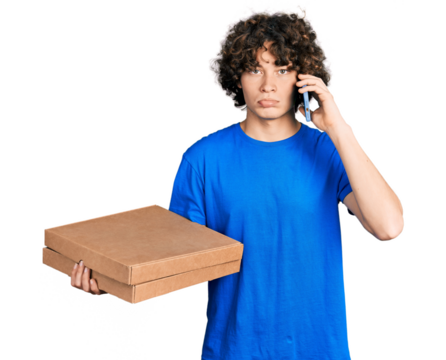 Caucasian teenager holding delivery package and talking by the smartphone depressed and worry for distress, crying angry and afraid. sad expression.