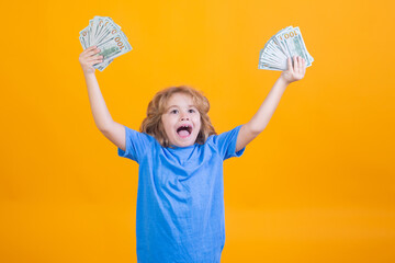 Rich child with dollars. Lottery cashback, win big money isolated yellow background.